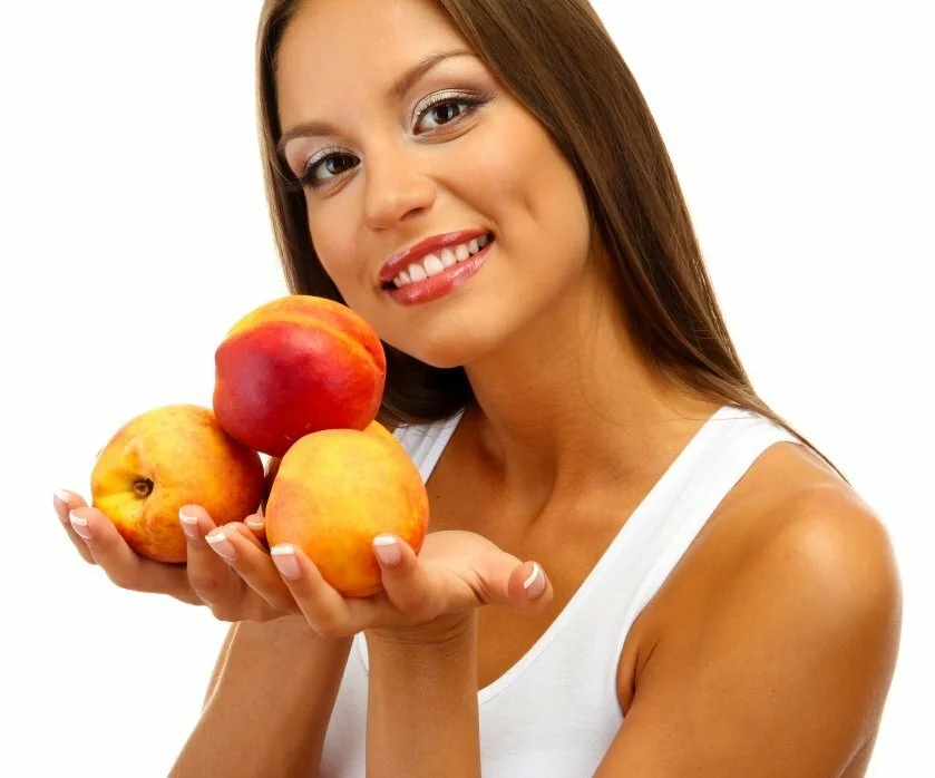 woman with peaches