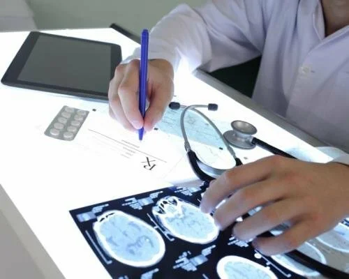 Doctor Checking Brain Scans CandianPharmacyMeds.com