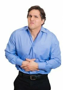 Man with stomach pain CanadianPharmacyMeds.com