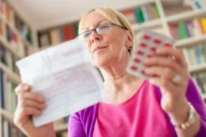 Woman with Medications CanadianPharmacyMeds.com