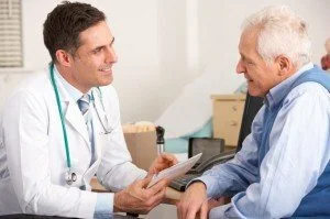 Doctor speaking with elderly patient CanadianPharmacyMeds.com