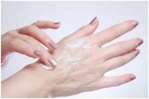 Applying lotion to skin CanadianPharmacyMeds.com