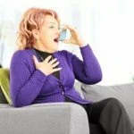 Woman using inhaler CanadianPharmacyMeds.com