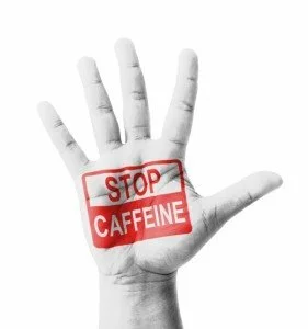 Hand showing stop caffeine CanadianPharmacyMeds.com