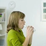 Woman doing breathing treatment CanadianPharmacyMeds.com