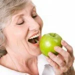 Elderly woman eating healthy CanadianPharmacyMeds.com