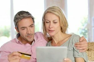 Couple arranging finances CanadianPharmacyMeds.com